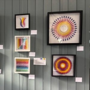 Colourful contemporary framed textile artworks displayed at the 2025 hART Exhibition in Hythe, Kent.