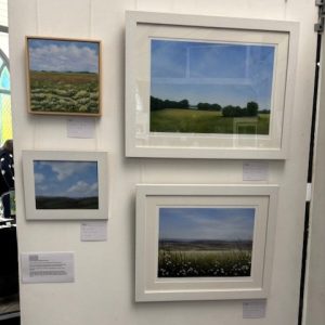 Original countryside landscape paintings displayed at the 2025 hART Exhibition in Hythe, Kent.