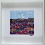 Colourful textile artwork by Carol Dixon featuring a seagull above a richly stitched coastal landscape