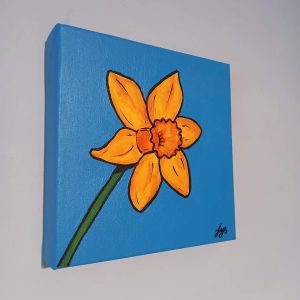 Orange and yellow daffodil painting on a blue background by artist Fiona Yorke-Saville.