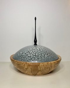 Decorative lidded wooden bowl with crackle-effect dome by Kent woodturner Julian Williamson.
