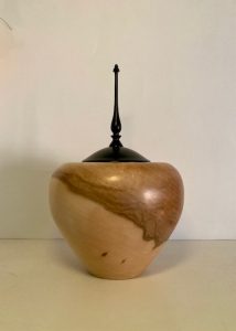 Hand-turned wooden vessel with black finial by Kent woodturner Julian Williamson, guest artist at the 2026 HART Exhibition.