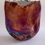 Sculptural ceramic vessel by Mary Sampson with copper, purple and turquoise surface colours