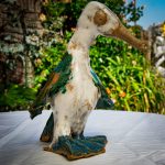 Standing ceramic bird sculpture by Mary Sampson with white, green and blue glaze